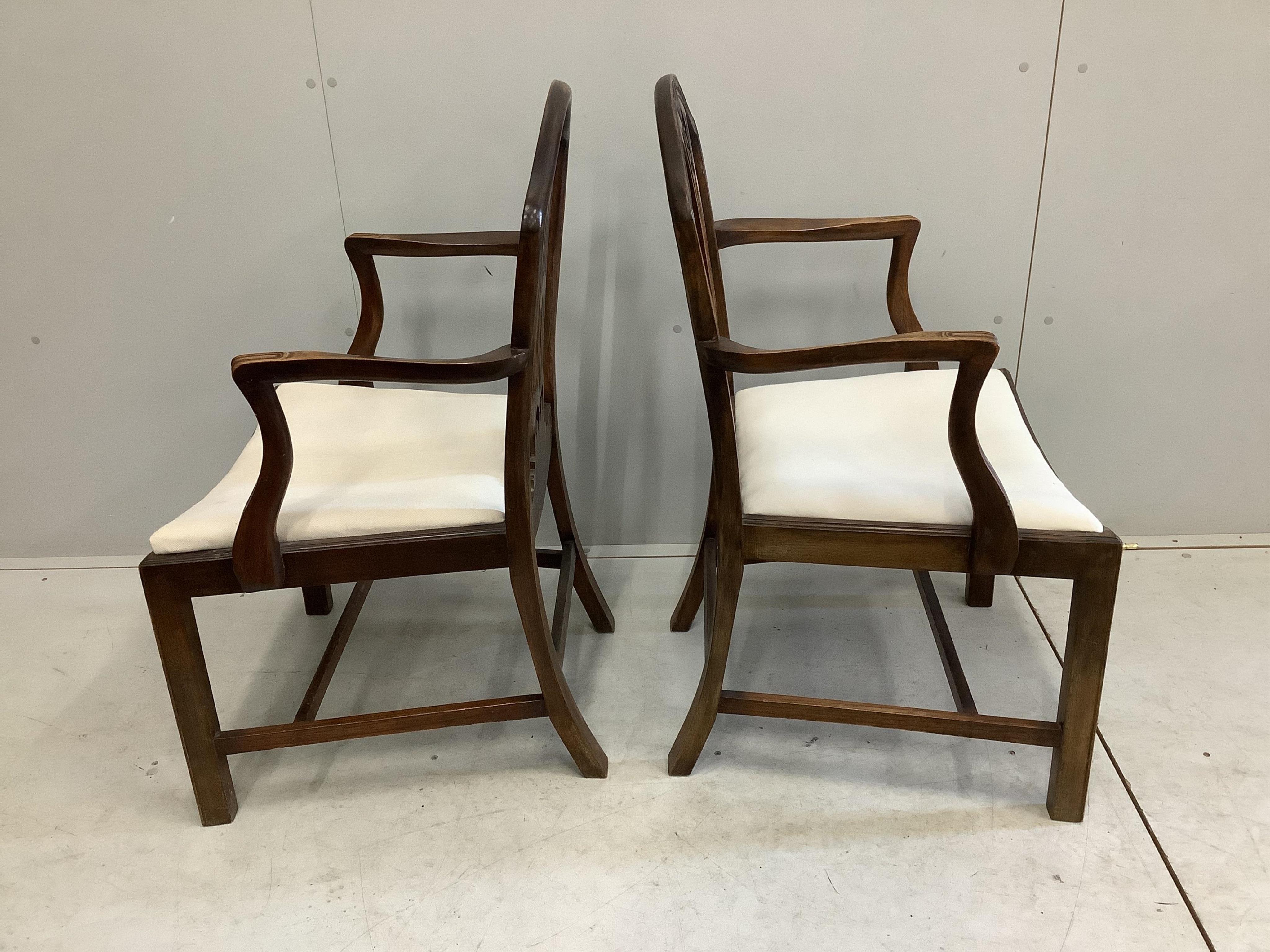 A set of eight George III style mahogany dining chairs,two with arms. Condition - fair to good